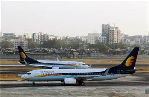 Jet Airways aircraft taxi on the tarmac at the domestic airport in Mumbai.