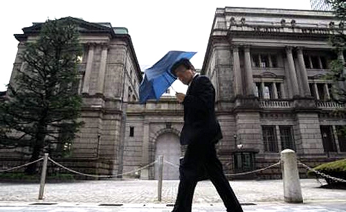  A man walks past the Bank of Japan building in Tokyo.