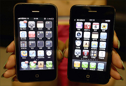 A posed picture shows a real iPhone 3GS alongside a fake model, in Beijing.