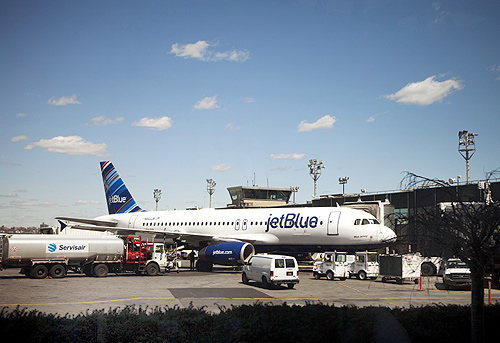 A JetBlue Airways plane awaits take off at LaGuardia Airport in New York.