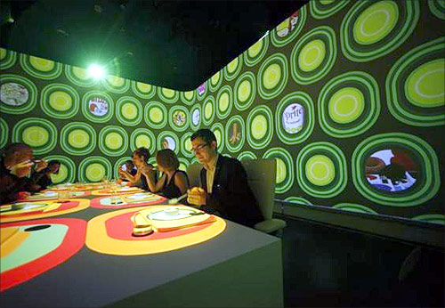 Guests attend a dinner at Ultraviolet restaurant in Shanghai.