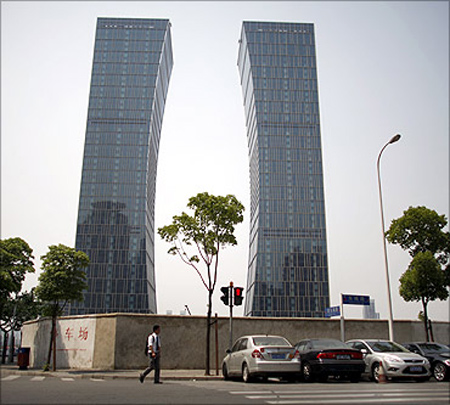 A man walks in Lujiazui, a financial district in Pudong, Shanghai.