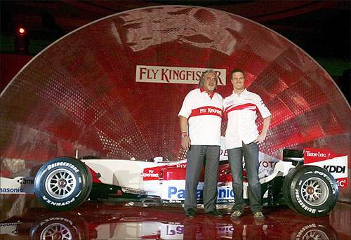 Vijay Mallya (L), Chairman and Chief Executive Officer of Kingfisher Airlines Ltd and Toyota's Formula One driver Ralf Schumacher of Germany.