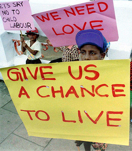 Street children protest against sexual abuse and the use children as domestic workers during a demonstration in Colombo.