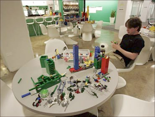 An employee plays with lego at the New York City offices of Google.