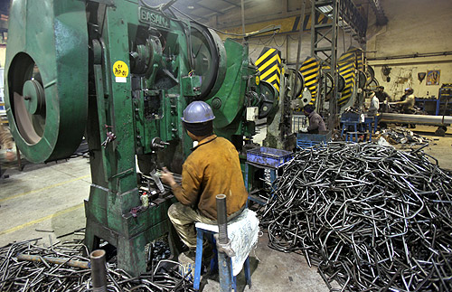 Men work inside a steel factory at Ludhiana in the northern Indian state of Punjab.
