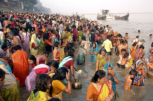 Devotees take a dip in the holy Ganges river during celebrations for the Chhat Puja festival.