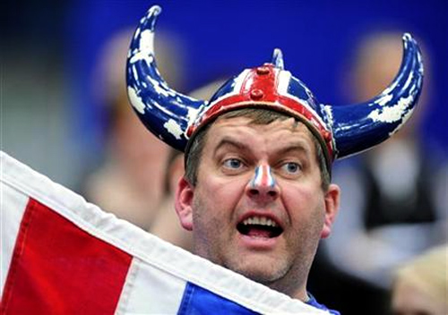 An Iceland fan shouts during their men's European Handball Championship group B match against Serbia in Linz.