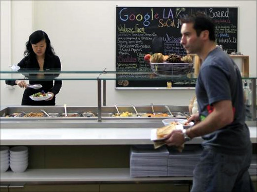 People eat in the cafeteria at the Google campus near Venice Beach, in Los Angeles.
