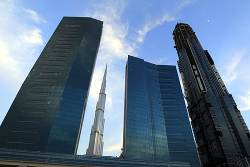 The Burj Khalifa (C) is seen, framed by towers and buildings under construction on Sheikh Zayed road in Dubai.