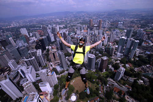 BASE jumper Eder Navacerrada of Spain leaps before opening his parachute, from Kuala Lumpur Tower.