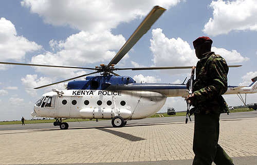 A Kenyan policeman guards a helicopter transporting seized heroin from the port city of Mombasa at Wilson airport in the capital Nairobi.