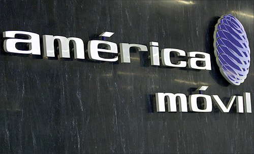 The logo of America Movil is seen on the wall of the reception area in the company's new corporate offices in Mexico City.