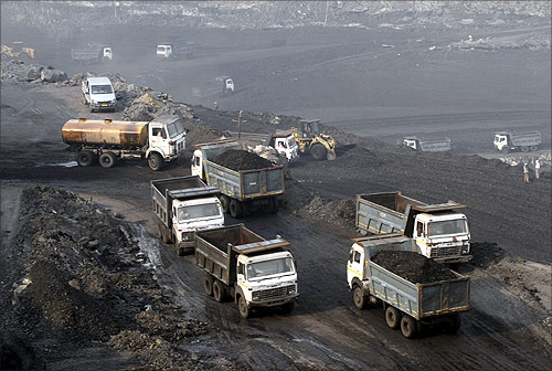 Trucks move in the Mahanadi coal fields, near Talcher town in Orissa.