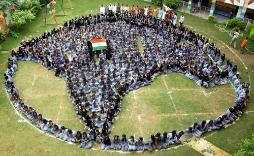 School girls form a shape of India as they pray for world peace at Jodhpur in Rajasthan.