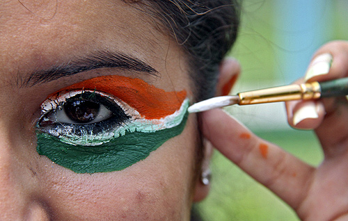 A college girl gets her eye painted in tri-colours of India's national flag on the eve of the country's Independence Day celebrations in the northern Indian city of Chandigarh.