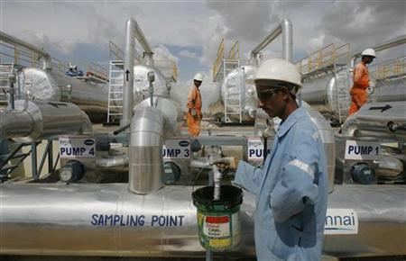 Cairn India employees work at a storage facility for crude oil at Mangala oil field at Barmer in Rajasthan.