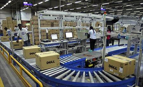 Computers packed into boxes are transported on a conveyor belt at a Dell factory in Sriperumbudur Taluk, in the Kancheepuram district of Tamil Nadu.