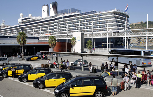 People wait in a taxi stand at a Barcelona's cruise terminal.