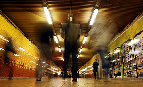 People walk inside a tunnel at Central train station in Sydney.