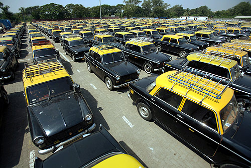 Taxi cabs are seen parked during a one-day strike in Mumbai.