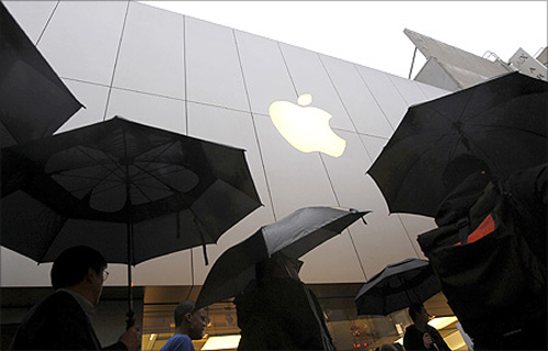 Customers enter the Apple flagship retail store to purchase the new iPad in San Francisco, California.