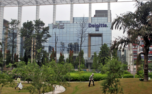 Deloitte Company logo is seen on a commercial tower at Gurgaon, on the outskirts of New Delhi.