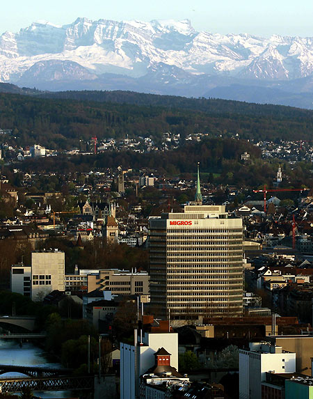 A general view shows the headquarters of Swiss Migros group in front of the city of Zurich and the eastern Swiss Alps.