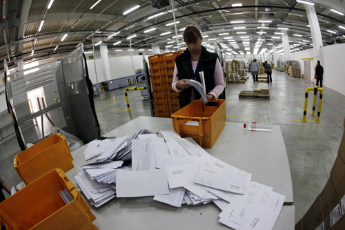 A worker sorts mail in Bulgaria's main postal logistic centre in Sofia.