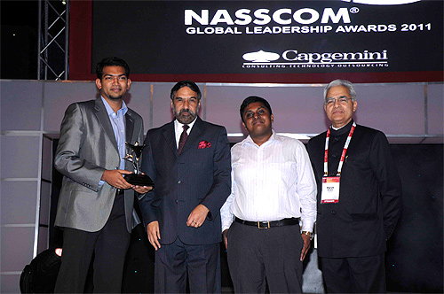 Sanjay Vijayakumar, Co-founder and Chief Executive Officer, MobME receives the Nasscom award from Anand Sharma,  Minister for Commerce and Industries, former Nasscom chairman, Harsh Manglik, Vivek Francis,  MobME Co-founder MobME.