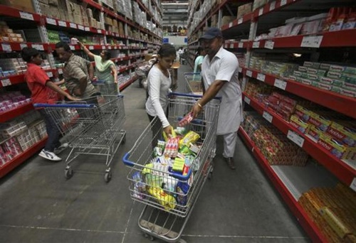 Customers shop at a Best Price Modern Wholesale store, a joint venture of Wal-Mart Stores Inc and Bharti Enterprises, at Zirakpur in Punjab.