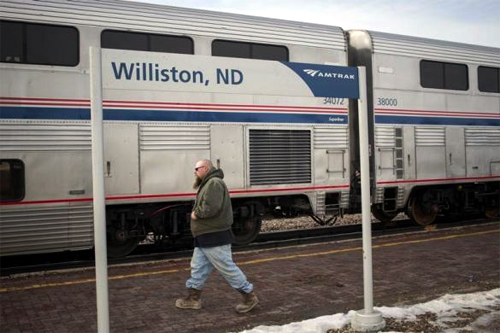 A man walks by the Amtrak train station in Williston, North Dakota.