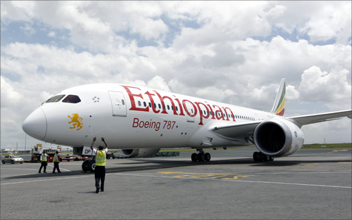 A cabin crew member (L) walks inside an Ethiopian Airlines' 787 Dreamliner after it arrived at the Jomo Kenyatta international airport in Kenya's capital Nairobi.