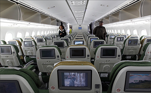A cabin crew member (L) walks inside an Ethiopian Airlines' 787 Dreamliner after it arrived at the Jomo Kenyatta international airport in Kenya's capital Nairobi.