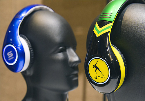 Tim Tebow (L) and Usain Bolt-themed Soul SL300 noise canceling headphones displayed at the opening press event of the Consumer Electronics Show (CES) in Las Vegas.