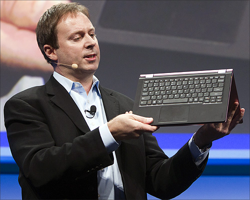 Kirk Skaugen, Intel's vice president of PC client group, converts a Lenovo Yoga Ultrabook into a tablet, at an Intel news conference during the Consumer Electronics Show (CES) in Las Vegas.