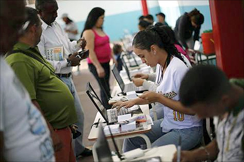Venezuelans line up to cast their votes during a governors election in Caracas.