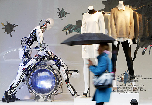 A pedestrian walks past a window display at a shopping mall in central Moscow.
