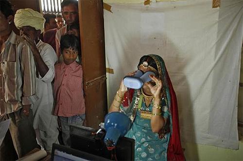 A villager goes through the process of eye scanning for Unique Identification (UID) database system at an enrolment centre at Merta district in Rajasthan.