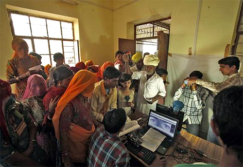 Villagers crowd inside an enrolment centre for the Unique Identification (UID) database system at Merta district in Rajasthan.