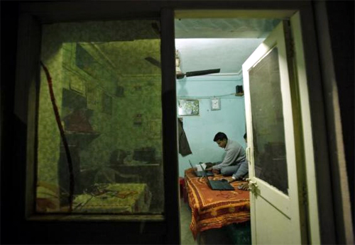 Unique Identification (UID) database system operators work inside a temporary space at Merta district in Rajasthan.