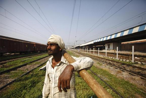 A worker is pictured at the newly built railway track in Allahabad.