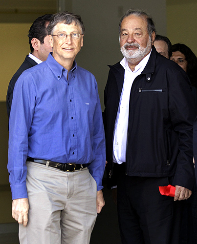 Mexican businessman Carlos Slim (R) stands with Microsoft founder and philanthropist Bill Gates after taking part in the inauguration of a new research facility at the International Maize and Wheat Improvement Center (CIMMYT) in Texcoco outside Mexico City.