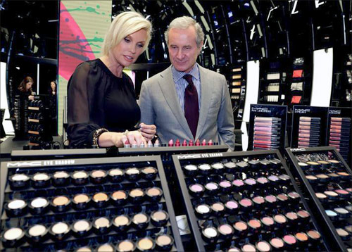 Fabrizio Freda (R), President and CEO, The Estee Lauder Companies, and Karen Buglisi (L), Global Brand President, M.A.C Cosmetics, pose in the M.A.C shop in Paris.