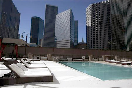 A swimming pool area is covered in snow after a storm dropped five inches of snow in downtown Dallas, Texas.
