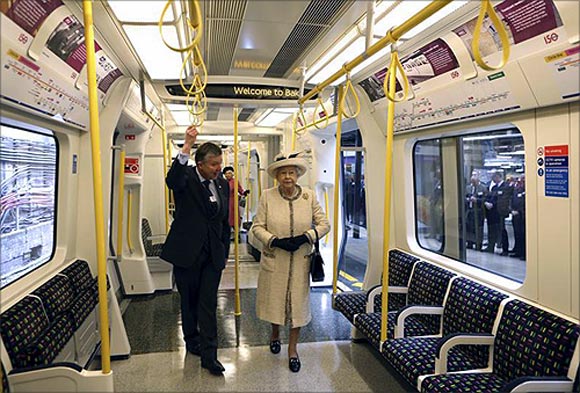 Britain's Queen Elizabeth speaks with Mike Brown, managing director of London Underground, as she inspects a tube train during her visit to Baker Street underground station in London.