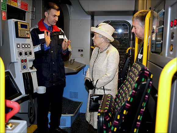 Britain's Queen Elizabeth is shown the drivers cabin of a tube train during a visit to Baker Street Underground Station in London.