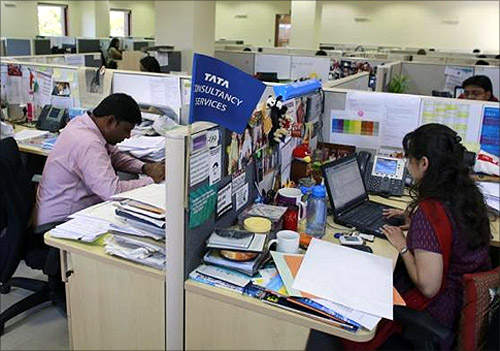 Employees of Tata Consultancy Services (TCS) work inside the company headquarters in Mumbai.