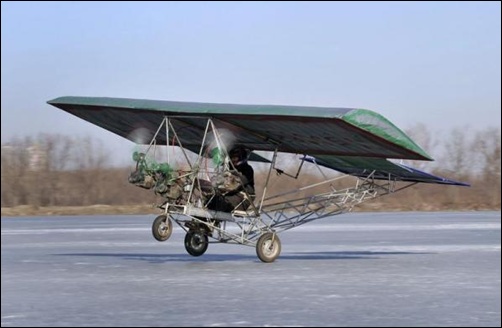 Ding Shilu, an automobile mechanic, carries out a test-flight for his self-made aircraft at a frozen reservoir in Shenyang, Liaoning province.