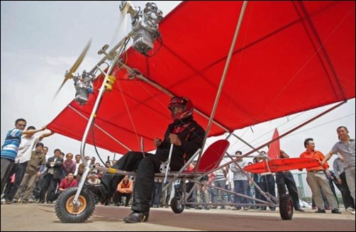 Farmer Shu Mansheng prepares to take off with his homemade ultralight aircraft in Wuhan, Hubei province, China.
